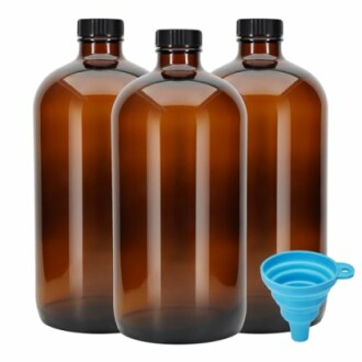 Three amber glass bottles with black caps and a blue collapsible funnel.