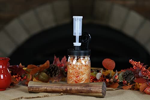 Fermentation jar with pump and autumn decorations